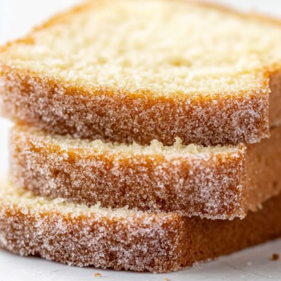 Three pieces of bread with sugar on top.
